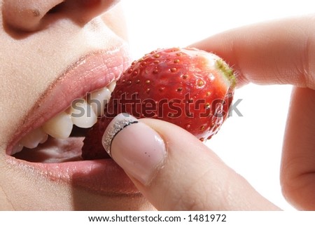 stock photo A sexy lips biting strawberry