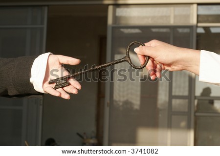 businessman holding the key to success.