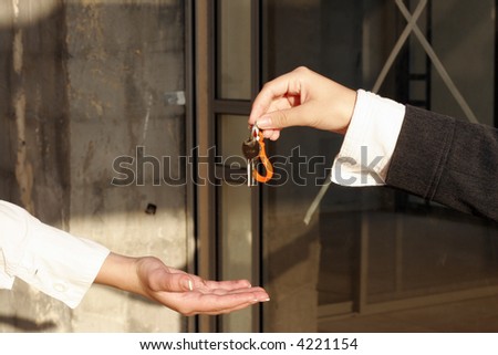 businessman holding the key to success.