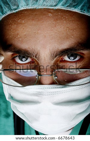 attentive look of working surgeon in operation room