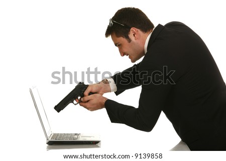 stock-photo-businessman-shooting-his-laptop-computer-with-a-handgun-9139858.jpg