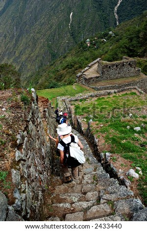 Ancient Inca steps with ruins in the background