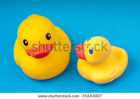 yellow rubber duck on blue background water