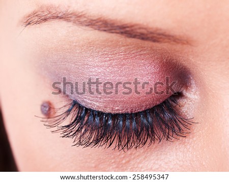 Close up of woman eye when applying eye pencil