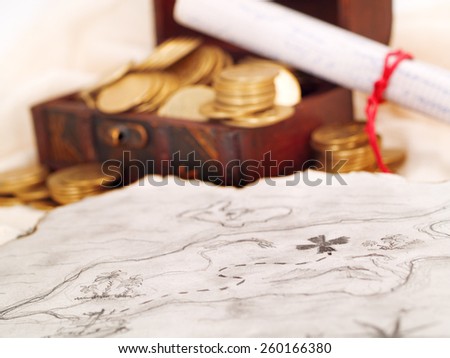 Treasure chest with gold coins, treasure map and a letter