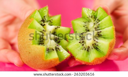 Two pieces of kiwi fruit cut for garnishing fruit salad