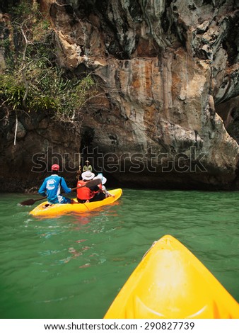 Pang Nga, Thailand - March 16, 2011 : Tourists kayaking in the hongs of Pang Nga Bay and taking photos