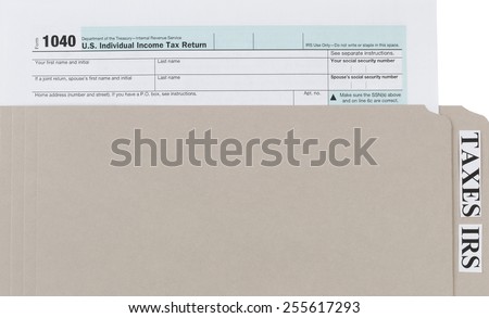 Individual income tax form inside of gray folder. Business financial concept for taxes.
