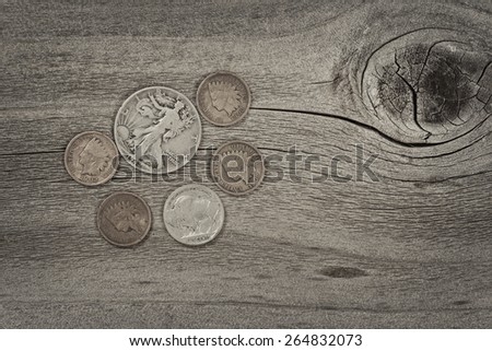 Old United States coins on rustic wood with vintage concept. Layout in horizontal format.