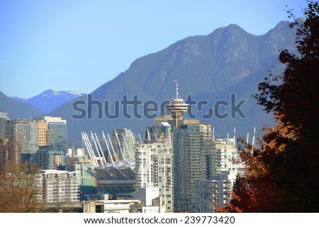 Vancouver city skyline and Harbour Centre Tower with Mount Fromme at the background, Vancouver, British Columbia, Canada.