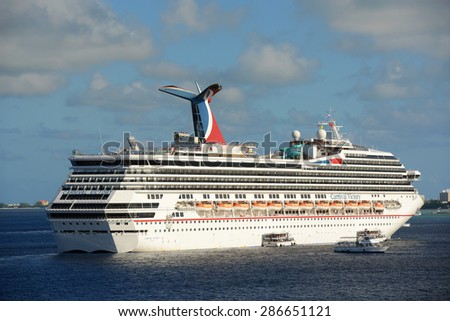 CAYMAN ISLANDS - DEC 30: Carnival Cruise ship Victory anchore offshore on December 30th, 2014 in George Town, Cayman Islands.