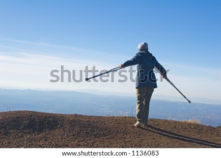 Yang woman hiking on crutches