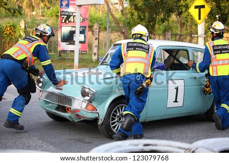 BANGSAEN, THAILAND - DEC. 21 : The rescue team clearing an accident racing cars from the track during the Bangsaen Thailand Speed Festival 2012 on December 21, 2012 in Bangsaen Thailand.
