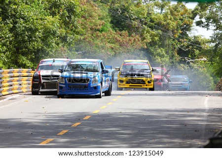 BANGSAEN, THAILAND - DEC. 23 : Group of racing cars in truck race during the Bangsaen Thailand Speed Festival 2012 on December 23, 2012 in Bangsaen Thailand.