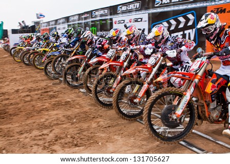 SI RACHA, THAILAND - MAR. 10 : The unidetified riders at start line in The FIM Motocross World Championship Grandprix of Thailand, on March 10, 2013. Thailand.