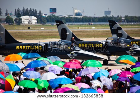 BANGKOK THAILAND - MARCH 23 : The acrobatic Britling Jet Team performed at event of Breitling Jet Team Under The Royal Sky at Royal Thai Airforce Base Donmuang on March 23, 2013, in Bangkok Thailand.