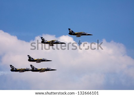 BANGKOK THAILAND - MARCH 23 : The acrobatic Britling Jet Team performed at event of Breitling Jet Team Under The Royal Sky at Royal Thai Airforce Base Donmuang on March 23, 2013, in Bangkok Thailand.