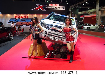 NONTHABURI THAILAND-JUNE 20 : Unidentified modelling post over truck at Bangkok International Auto Salon 2013 on June 20, 2013. The event exiting modified car showed in Nonthaburi, Thailand.