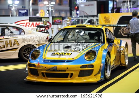 NONTHABURI - NOVEMBER 28: Porsche decoration and modify for racing by Sngha Team display on stage at The 30th Thailand International Motor Expo on November 28, 2013 in Nonthaburi, Thailand.