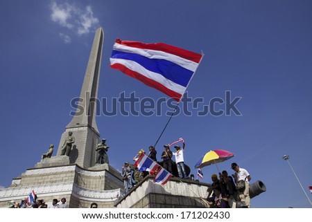 BANGKOK - JANUARY 13 : Protesters against the government rally together near Victory Monument on January 13, 2014 in Bangkok, Thailand