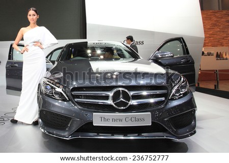 BANGKOK - DECEMBER 9 : Pretty models posted over Mercedes Benz The new C-Class displayed on stage in Motor Expo 2014, on dec. 9, 2014 in Bangkok, Thailand.
