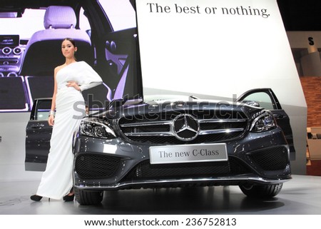 BANGKOK - DECEMBER 9 : An unidentify pretty model posted over Mercedes Benz The new C-Class C300 BlueTEC Hybrid AMG Dynamic displayed on stage in Motor Expo 2014, on dec. 9, 2014 in Bangkok, Thailand.