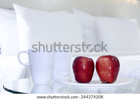 Apples  present for breakfast in the bedroom.