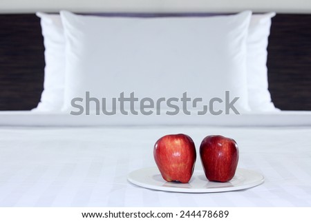 Apples present for breakfast in the bedroom.