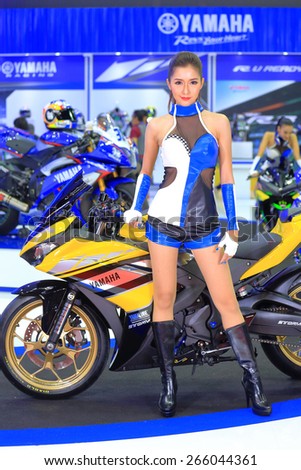 BANGKOK, THAILAND - MARCH 24 : Yamaha sport bike with super model displayed at the 36th Bangkok International Motor show  in March 24, 2015. Bangkok, Thailand.