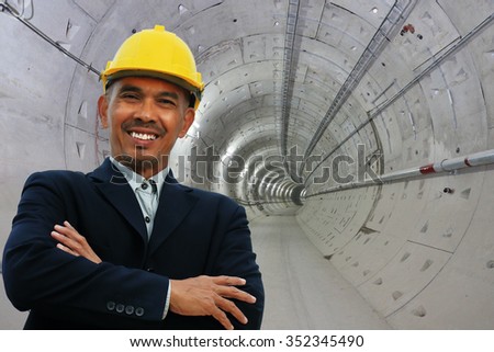Engineer stand over tunnel site