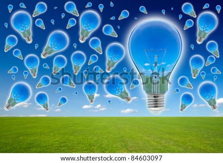 Many blubs on the blue sky. Ecological concept, reflection of nature in lamps.