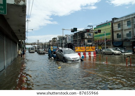 BANGKOK - OCTOBER 28: flooded Bangkok, water covers city streets with 3 ft, car cannot be used, 2 million people are effected on Oct. 28, 2011. Flooding is all around Bangkok.
