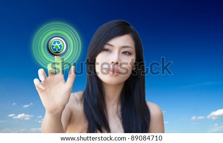 Portrait of Asian girl press recycle button, creative concept of ecological
