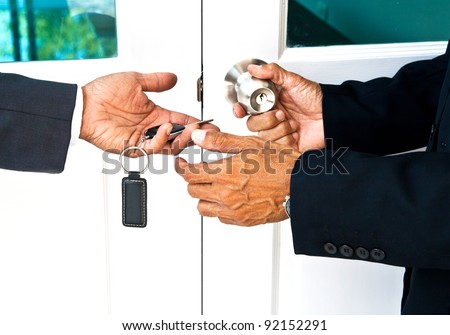Image for real estate business, businessman recirved the key to opening door knob
