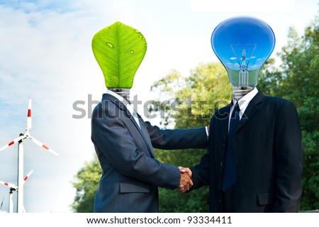Fantasy business persons on Ecological Concept, light bulb head and green leaf head with wind turbine on the background.
