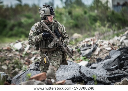 soldier on patrol at modern battle field