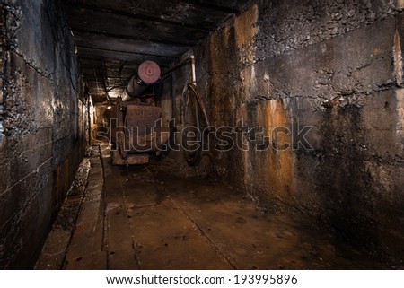 coal cart in abandoned tunnel in mine