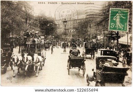 FRANCE - CIRCA 1913: a stamp printed by FRANCE shows Marianne the allegory of French Republic. The stamp is on the postcard shows view of Boulevard Montmartre in Paris, circa 1913.