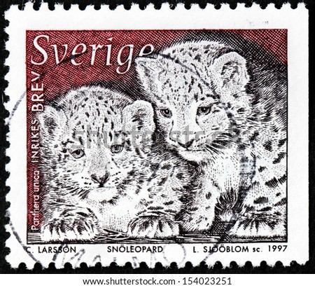 SWEDEN - CIRCA 1997: a stamp printed by Sweden shows image of two Snow Leopard Cubs (Panthera uncia), circa 1997.