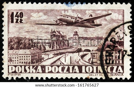 POLAND - CIRCA 1952: A stamp printed by POLAND shows airplane and bird\'s-eye view of  Warsaw, circa 1952
