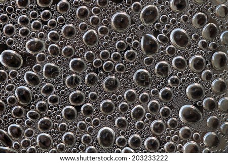 Closeup view of coffee-pot cover surface near boiling point temperature, soft focus