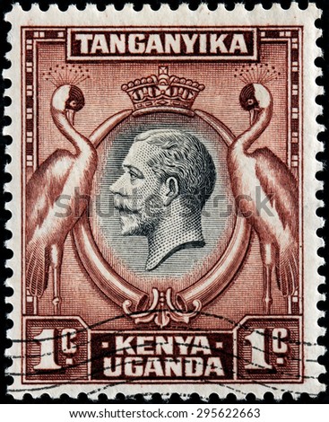 EAST AFRICAN COMMUNITY - CIRCA MAY, 1935: A stamp printed by EAST AFRICAN COMMUNITY shows portrait of King George V against two Grey Crowned Cranes