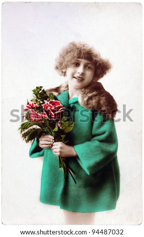 FRANCE - CIRCA 1919: a vintage postcard printed in France shows hand painted photograph of young girl with flowers, circa 1919.