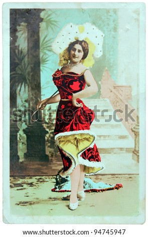 GERMANY - CIRCA 1900: a vintage postcard printed in GERMANY shows hand painted photograph of beautiful lady in fashion dress of 1900. Circa 1900.