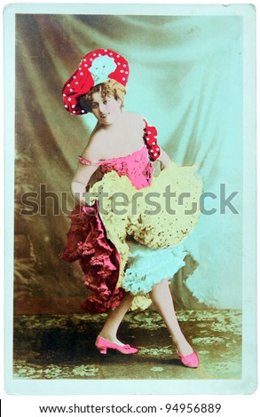 GERMANY - CIRCA 1900: A vintage postcard printed in GERMANY shows hand painted photograph of beautiful lady in fashion dress of 1900. Circa 1900.