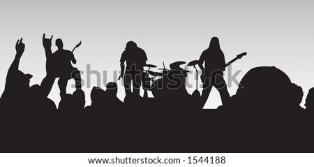 Concert silhouette with crowd cheering and rocking out.