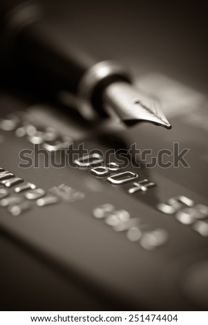 Image of money, credit cards, checks and coins. Black and white