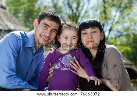 Happy family picture in the bright spring sunshine