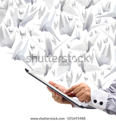 Business woman hands are holding and point on touch screen With Origami paper Birds to fly