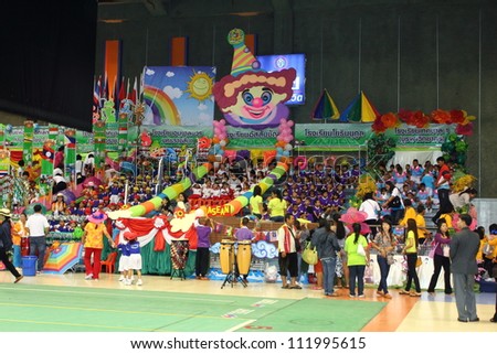 KORAT, THAILAND - SEP 5 : Kindergarten children\'s sporting events seat school cheering division at The mall department store mcc hall on September 5, 2012 in Nakhonratchasima,Thailand